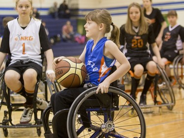 Players compete in a wheelchair basketball tournament at Bishop Mahoney High School on  April 10, 2016.