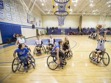 Players compete in a wheelchair basketball tournament at Bishop Mahoney High School on April 10, 2016.