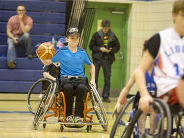 Players compete in a wheelchair basketball tournament at Bishop Mahoney High School on April 10, 2016.