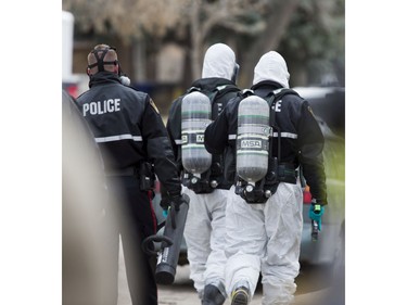 Police move in on the house in question with the Saskatoon Fire department and their Hazmat unit on standby at a situation in the 300 block Avenue K North, April 15, 2016.