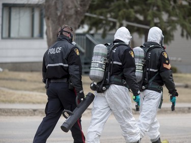 Police move in on the house in question with the Saskatoon Fire department and their Hazmat unit on standby at a situation in the 300 block Avenue K North, April 15, 2016.