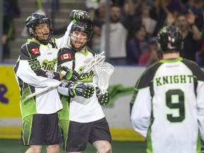 Jarrett Davis  of Saskatchewan Rush, left, congratulates Ben McIntosh on a goal against the Colorado Mammoth in NLL action on Saturday, April 16th, 2016