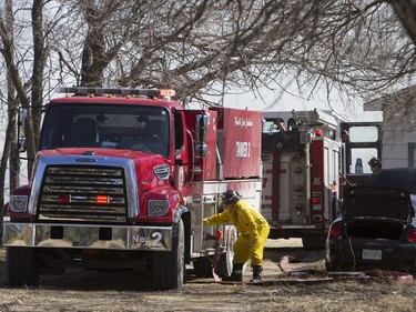 Saskatoon and Warmen firefighters battle a grass fire on an acreage north of Cathedral Bluffs on April 17, 2016.
