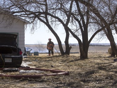 Saskatoon and Warmen firefighters battle a grass fire on an acreage north of Cathedral Bluffs on April 17, 2016.