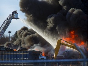SASKATOON, SASK.; APRIL 19, 2016 -  0420 news fire  A auto wreckers yard at Ave. P. S. and 14 st. W. was burning intensely for firefighters who attached with the ladder truck,  April 19, 2016. (GordWaldner/Saskatoon StarPhoenix)
