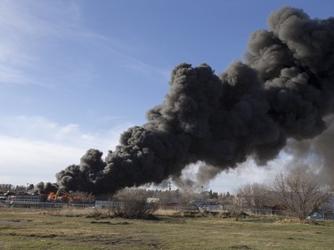 An auto wrecking yard at Avenue P South and 14th Street West was burning intensely for firefighters who battled it with their ladder truck, April 19, 2016.