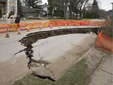 A section of Saskatchewan Crescent East, near 16th Street east is blocked off after a larger area succumbed to erosion on April 24, 2016.