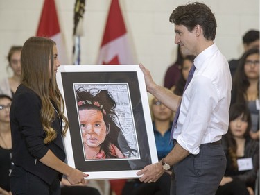 Prime Minister Justin Trudeau was presented with many gifts after speaking and answering questions at an assembly at Oskayak High School, April 27, 2016. Trudeau visited the Aboriginal Youth Entrepreneurship Program during the school tour.