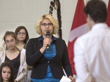 Prime Minister Justin Trudeau answers students' questions, including Tahris Bear, at Oskayak High School after touring the school and the Aboriginal Youth Entrepreneurship Program, April 27, 2016.