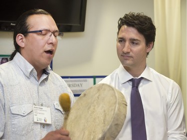 Prime Minister Justin Trudeau was greeted with songs sung by Waylon Badger, a morning ritual at Oskayak High School, after touring the school and the Aboriginal Youth Entrepreneurship Program, April 27, 2016.