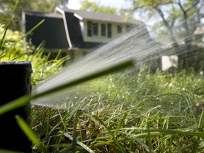 A lawn is watered during the water ban in Saskatoon in the Broadway area on June 28, 2011.
