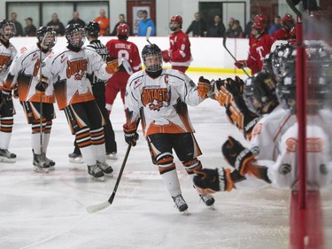 The Saskatoon Contacts celebrate a goal against the Kenora Thistles during the Telus Cup regional opener game at Rod Hamm Memorial Arena in Saskatoon, March 31, 2016.