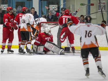 The linesman waves off a Saskatoon Contacts goal against the Kenora Thistles during the Telus Cup regional opener game at Rod Hamm Memorial Arena in Saskatoon, March 31, 2016.