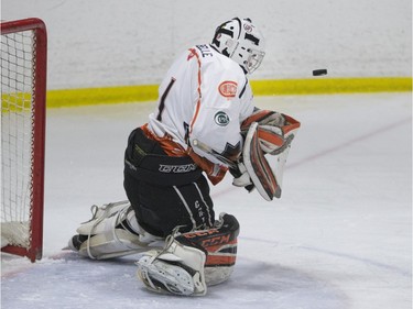 Saskatoon Contacts goalie Isaac LaBelle makes a save against the Kenora Thistles during the Telus Cup regional opener game at Rod Hamm Memorial Arena in Saskatoon, March 31, 2016.