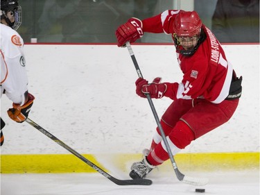 Kenora Thistles defencmen Elijah Loon-Stewardson moves the puck against the Saskatoon Contacts during the Telus Cup regional opener game at Rod Hamm Memorial Arena in Saskatoon, March 31, 2016.