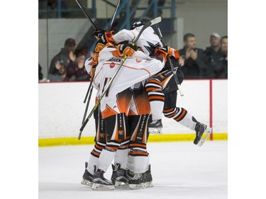 The Saskatoon Contacts celebrate a goal against the Kenora Thistles during the Telus Cup regional opener game at Rod Hamm Memorial Arena in Saskatoon, March 31, 2016.