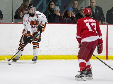 Saskatoon Contacts forward Carson Albrecht moves the puck against the Kenora Thistles during the Telus Cup regional opener game at Rod Hamm Memorial Arena in Saskatoon, March 31, 2016.