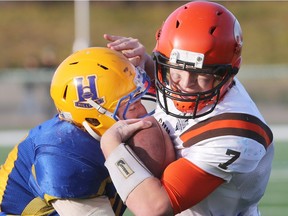 Saskatoon Hilltops Cameron Schnitzler tackles Okanagan Sun Cam Bedore in the 2015 Canadian Bowl in Saskatoon.