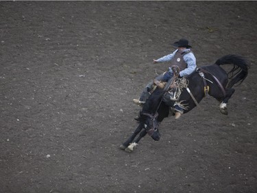 Anthony Potvin from Austin, Manitoba competes in the Saddle Bronc at the Saskatoon Summer Rodeo at the Sasktel Centre in Saskatoon, Saskatchewan on Saturday, April 23rd, 2016.