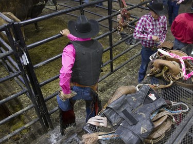 Shane Wolfe stretches before competing in the Novice Saddle Bronc during the Saskatoon Summer Rodeo at the Sasktel Centre in Saskatoon, Saskatchewan on Saturday, April 23rd, 2016.