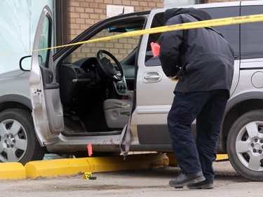 Detectives from the Saskatoon police major crimes and forensic identification units investigate after a man died in the Sutherland area on April 24 in Saskatoon.