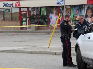 Detectives from the Saskatoon police major crimes and forensic identification units investigate after a man died in the Sutherland area on April 24 in Saskatoon.