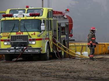 Firefighters continue to battle a fire at Shercom Industries in the North Corman Industrial Park north of Saskatoon, April 5, 2016. The fire has been burning all night and the fuel of recycled rubber products has been hard to extinguish.