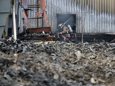 Firefighters continue to battle a fire at Shercom Industries in the North Corman Industrial Park north of Saskatoon, April 5, 2016. The fire has been burning all night and the fuel of recycled rubber products has been hard to extinguish.