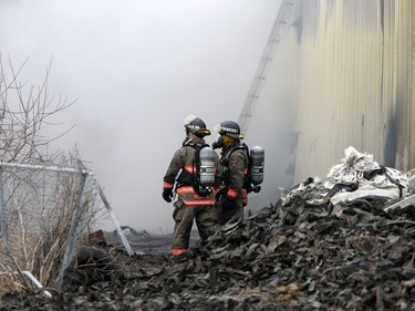 Firefighters continue to battle a fire at Shercom Industries in the North Corman Industrial Park north of Saskatoon, April 5, 2016. The fire has been burning all night and the fuel of recycled rubber products has been hard to extinguish.