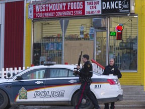 Police on the scene at Westmount Foods on 29th Street West after a robbery on April 11, 2016.