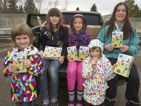 Girl Guides, l to r, Katie Newell, Cammy Moulder-Finlayson, Elizabeth Moulder-Finlayson, Libby Newell and Aria Basoalto pick up their Girl Guide cookies at Roland Michener Schooll on April 13.