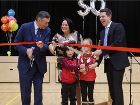 Dignitaries including Minister of Education Don Morgan; Diane Boyko, Chair GSCS Board of Education; principal Francois Rivard, and student reps cut a ribbon at Ecole St. Mathew School for a ceremony in the school's new gym celebrating completion of renovations and the school's 50th anniversary, Friday, April 15, 2016. (GREG PENDER/STAR PHOENIX)