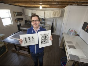 Michael Peterson shows work done on the etching press at Creative Commons YXE, a new space for artists.