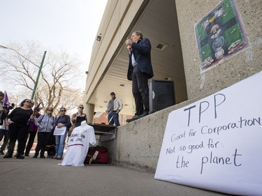 Members of Climate Justice Saskatoon and the local chapter of the Council of Canadians set up placards and protested outside the Radisson Hotel in Saskatoon to coincide with the city's public consultation on the Trans-Pacific Partnership (TPP) trade agreement, Wednesday, April 20, 2016.