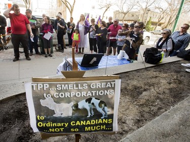 SASKATOON,SK-- April Members of Climate Justice Saskatoon and the local chapter of the Council of Canadians set up placards and protested outside the Radisson Hotel in Saskatoon to coincide with the city's public consultation on the Trans-Pacific Partnership (TPP) trade agreement, Wednesday, April 20, 2016.