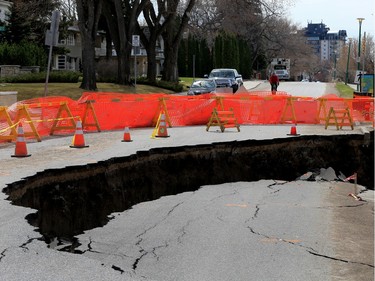 A land slump in the 800 block of Saskatchewan Crescent East, which has closed the road, has created a large sink hole, as seen April 25, 2016.