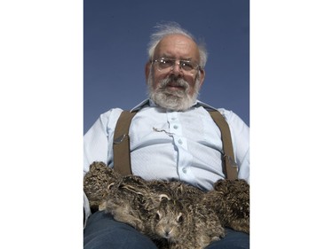 John Polson at Diefenbaker Park with 12 baby hares he rescued from the city, April 27, 2016.