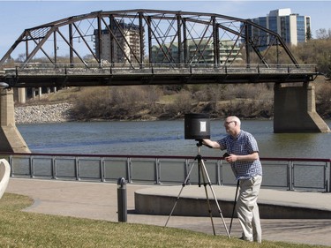 Photographer Gordon Holtslander uses a homemade pin hole camera to take a photo of the last remaining stand of the Traffic Bridge for posterity, April 28, 2016. The historical method of making photographs uses large plate film and long exposures. Samples of his work can be viewed at 500px.com/gordonjholtslander.