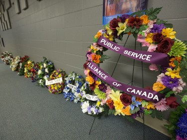 People gathered at Frances Morrison Central Library in Saskatoon for a National Day of Mourning Remembrance Ceremony for workers killed in the last year, April 28, 2016. Candles for workers killed were lit and wreaths laid at the City Hall memorial.