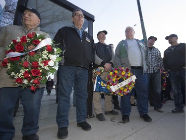 People gathered at Frances Morrison Central Library in Saskatoon for a National Day of Mourning Remembrance Ceremony for workers killed in the last year, April 28, 2016. Candles for workers killed were lit and wreaths laid at the City Hall memorial.