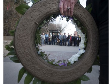 People gathered at Frances Morrison Central Library in Saskatoon for a National Day of Mourning Remembrance Ceremony for workers killed in the last year, April 28, 2016. Candles for workers killed were lit and wreaths laid at the City Hall memorial.