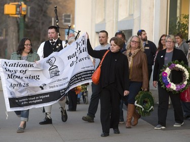 People gathered at Frances Morrison Central Library in Saskatoon for a National Day of Mourning Remembrance Ceremony for workers killed in the last year, April 28, 2016. Candles for workers killed were lit and wreaths laid at the City Hall memorial.