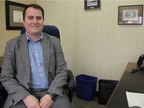 Seen in his office at the Greater Saskatoon Catholic Schools' headquarters, Joel Lloyd, the superintendent of administrative services notes the division is expecting to pay parents roughly $220,000 for driving their children to school as they're located outside of the City of Saskatoon away from assigned routes. (Morgan Modjeski/The Saskatoon StarPhoenix)