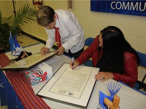 Shirley Isbister CUMFI President, left, and Diane Boyko, Chair of the GSCS Board of Education can be seen at St. Michael Community School on Monday where the two marked the signing of the historic Métis Education Alliance Agreement. (Morgan Modjeski/The Saskatoon StarPhoenix)