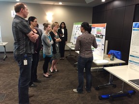 Students can be seen presenting their research poster to judges at the 2015 Sanofi Biogenius Canada competition in Saskatchewan. A handful of students from six local schools will be competing for the title and an opportunity to compete on the national stage in Ottawa in May as part of the competition being held at the University of Saskatchewan campus this week. (Supplied/Sanofi Biogenius Canada)