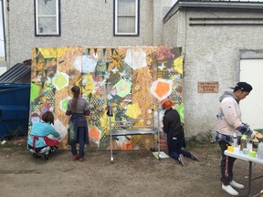 Students from Aden Bowman work on a painting for the Museum of Temporary Art (MoTA) in Riversdale.