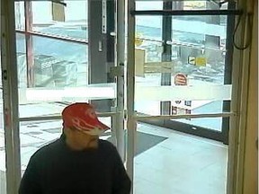 Surveillance photo from March 28 of a suspect believed responsible for robbing  two Saskatoon banks.