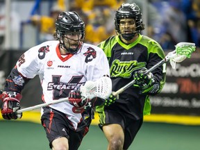 Vancouver Stealth defender Ian Hawksby moves the ball up the floor against Jeff Cornwall of the Saskatchewan Rush.