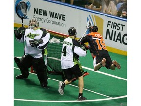 Bandits Chad Culp flies in the air while shooting the ball on Rush's Aaron Bold in the first half during Game One of best-of-three Champion's Cup final at First Niagara Center in Buffalo, N.Y., on Saturday.