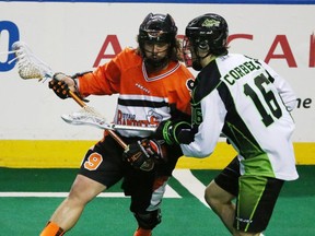 Buffalo Bandits Mark Steenhuis battles Saskatchewan Rush's Chris Corbell for the ball in the first half during Game 1 of best-of-three Champion's Cup final at First Niagara Center in Buffalo, NY on Saturday,May 28, 2016.